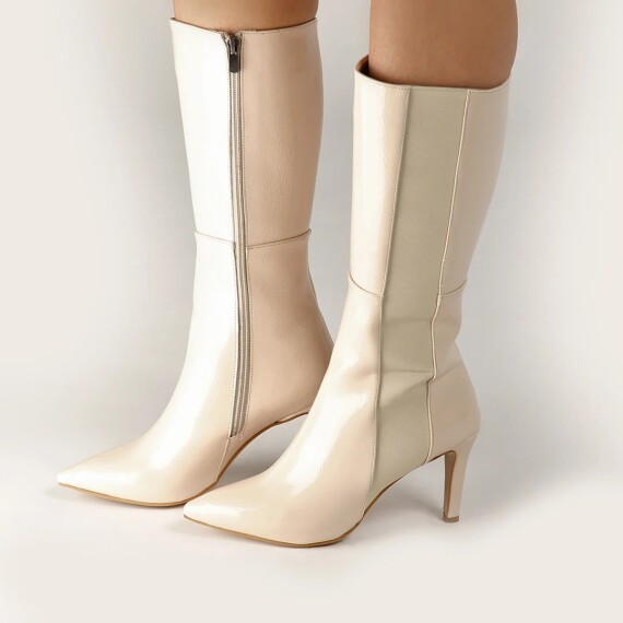 https://rawda-sy.kyveli.me/products/mid-shine-boots