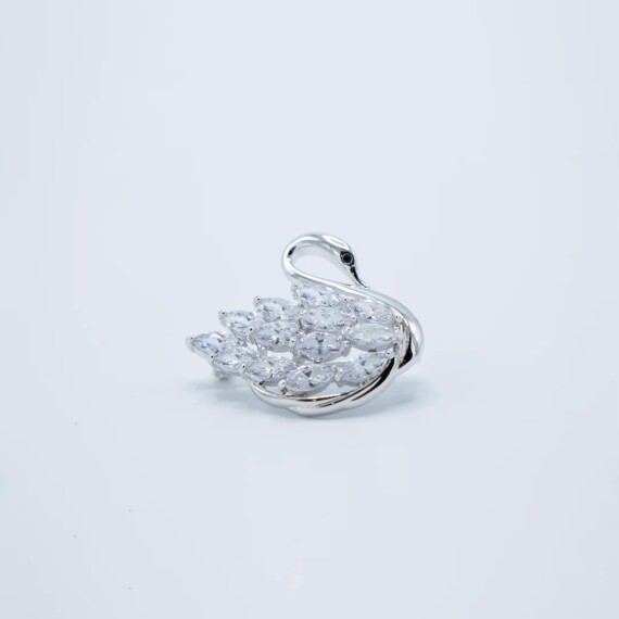 https://rawda-sy.kyveli.me/products/silver-pin-swan